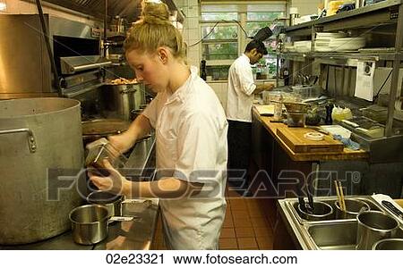 Team of restaurant kitchen staff busy at work. View Large Photo Image Stock Image - Team of restaurant kitchen staff busy at work.. Fotosearch