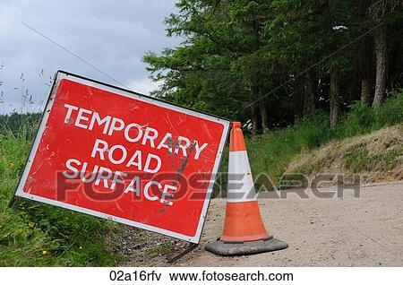 Temporary road surface road sign in a rural lane View Large Photo Image Stock Photo - Temporary road surface road sign in a rural lane. Fotosearch