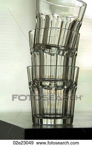 Three clear glass tumblers stacked. View Large Photo Image Stock Photo - Three clear glass tumblers stacked.. Fotosearch