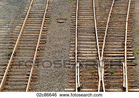 Three sets of parallel train tracks. View Large Photo Image Stock Photograph - Three sets of parallel train tracks.. Fotosearch