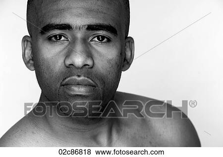Stock Photo - Tight face portrait of serious African-Amercan man.. Fotosearch