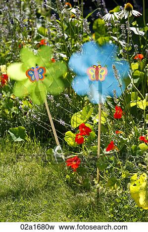 Toy flowers in a garden View Large Photo Image Stock Photo - Toy flowers in a garden. Fotosearch