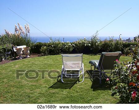 Two lawnchairs overlooking the ocean View Large Photo Image Stock Photography - Two lawnchairs overlooking the ocean. Fotosearch