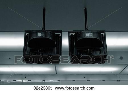 Two overhead security televisions. View Large Photo Image Stock Photography - Two overhead security televisions.. Fotosearch
