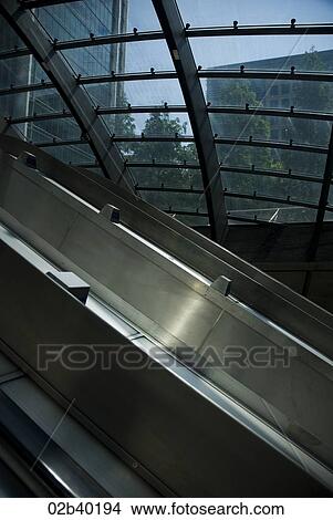 Picture - Underground elevator looking out through glass roof. Fotosearch