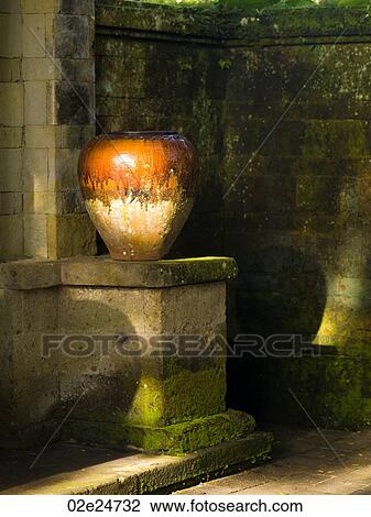 Vase on and moss covered wall in Bali View Large Photo Image Stock Image - Vase on and moss covered wall in Bali. Fotosearch
