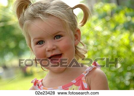 Stock Photo - Very happy little girl.. Fotosearch