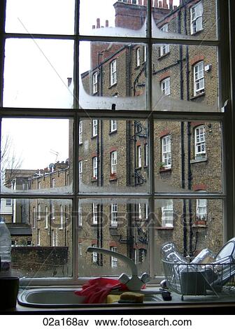 View of a building through a kitchen window View Large Photo Image Stock Photo - View of a building through a kitchen window. Fotosearch