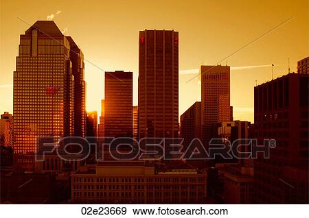 Stock Photo - Warm sunset over Calgary's skyline.. Fotosearch