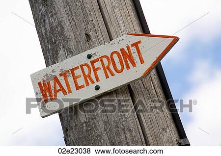 Waterfront sign pointing to the beach. View Large Photo Image Stock Photo - Waterfront sign pointing to the beach.. Fotosearch