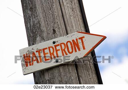 Waterfront sign posted on old wooded pole. View Large Photo Image Stock Photo - Waterfront sign posted on old wooded pole.. Fotosearch