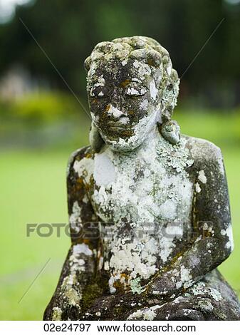 Stock Photo - Weathered statue in Bali. Fotosearch
