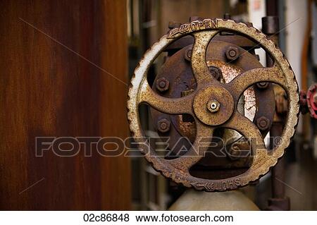Wheeled metal valve control with tarnished surface. View Large Photo Image Stock Photo - Wheeled metal valve control with tarnished surface.. Fotosearch