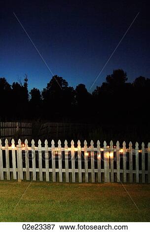 White picket fence at night with lights on. View Large Photo Image Stock Photo - White picket fence at night with lights on.. Fotosearch