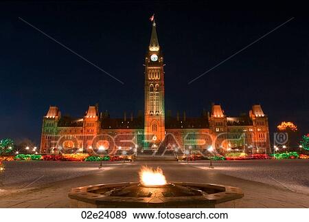 Winter view of Canada's Parliament buildings with Eternal Flame. View Large Photo Image Stock Photo - Winter view of Canada's Parliament buildings with Eternal Flame.. Fotosearch