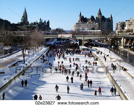 Stock Photo - Winterlude skaters on Rideau Canal skate-way, Ottawa Canada.. Fotosearch
