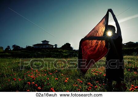 Woman holds red shawl in field of wildflowers, sunset, Granada, Andalusia View Large Photo Image Stock Image - Woman holds red shawl in field of wildflowers, sunset, Granada, Andalusia. Fotosearch
