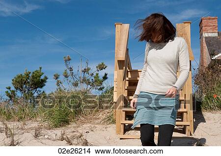 Woman on the beach in the Hamptons View Large Photo Image Picture - Woman on the beach in the Hamptons. Fotosearch