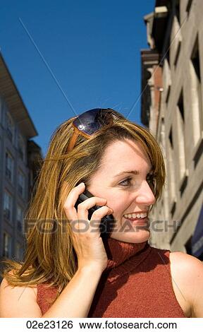 Woman talking on PDA, cellular. View Large Photo Image Stock Photograph - Woman talking on PDA, cellular.. Fotosearch