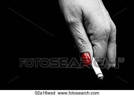 Woman with red nails holds a cigarette View Large Photo Image Stock Image - Woman with red nails holds a cigarette. Fotosearch