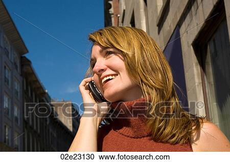 Women talking on PDA, cell phone View Large Photo Image Stock Image - Women talking on PDA, cell phone. Fotosearch
