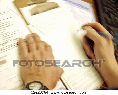 Writing orders by hand. View Large Photo Image Picture - Writing orders by hand.. Fotosearch