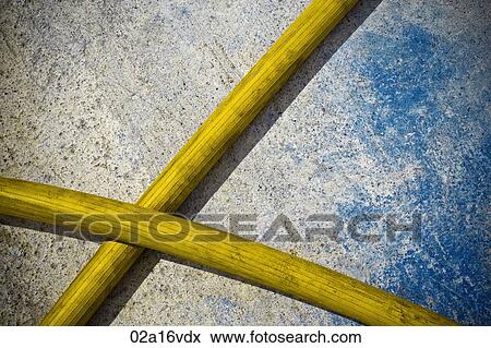 Yellow hose pipes against blue and cement background View Large Photo Image Stock Photo - Yellow hose pipes against blue and cement background. Fotosearch