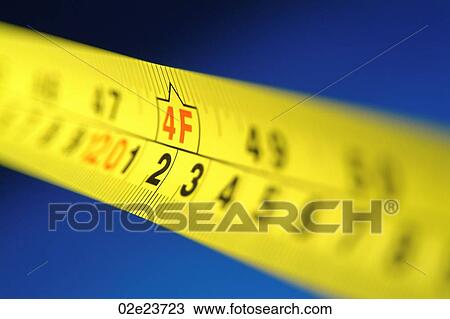 Yellow retractable measuring tape. View Large Photo Image Stock Image - Yellow retractable measuring tape.. Fotosearch