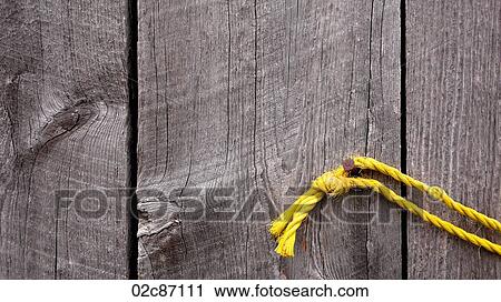 Yellow rope on old weathered wood planks. View Large Photo Image Stock Image - Yellow rope on old weathered wood planks.. Fotosearch
