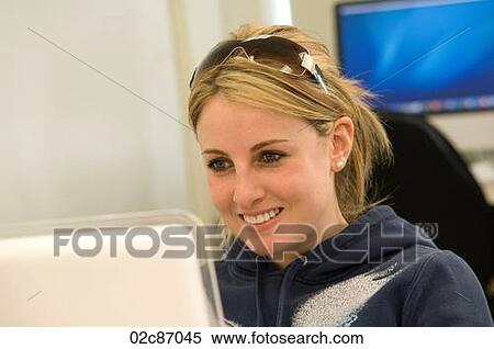 Young female student working on computer. View Large Photo Image Stock Photography - Young female student working on computer.. Fotosearch