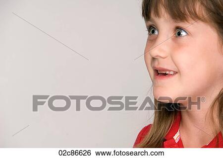 Young girl looking away with curiosity. View Large Photo Image Stock Photograph - Young girl looking away with curiosity.. Fotosearch