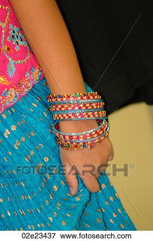 Young girl with colorful bracelets. View Large Photo Image Stock Photo - Young girl with colorful bracelets.. Fotosearch