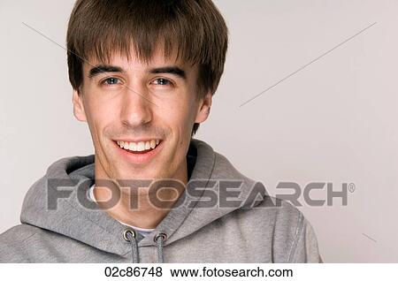 Young male wearing hooded sweatshirt. View Large Photo Image Stock Photo - Young male wearing hooded sweatshirt.. Fotosearch