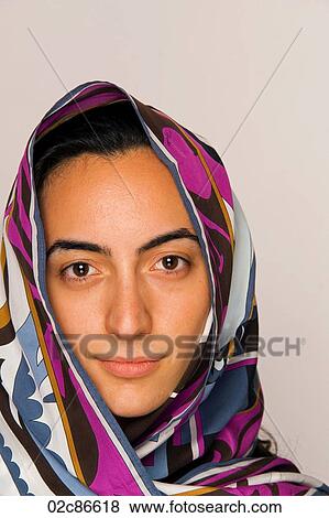 Young middle-eastern woman with head scarf. View Large Photo Image Stock Photo - Young middle-eastern woman with head scarf.. Fotosearch