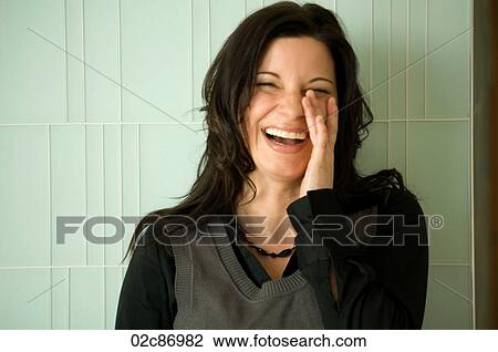 Stock Image - Young urban businesswoman laughing.. Fotosearch