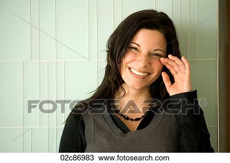 Stock Image - Young urban businesswoman laughing.. Fotosearch