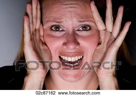 Young woman looking through hands stressed. View Large Photo Image Stock Image - Young woman looking through hands stressed.. Fotosearch