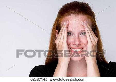 Young woman looking through hands smiling. View Large Photo Image Stock Photography - Young woman looking through hands smiling.. Fotosearch