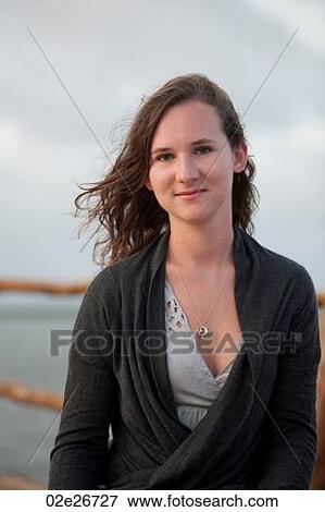 Stock Photo - 17 year old girl smiling at camera. Fotosearch