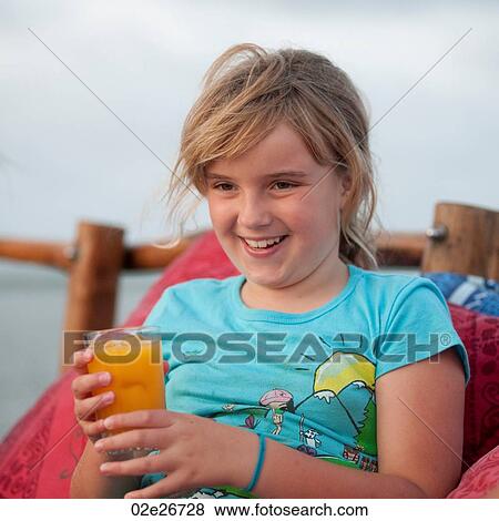 9 year old girl smiling at camera View Large Photo Image Stock Photo - 9 year old girl smiling at camera. Fotosearch