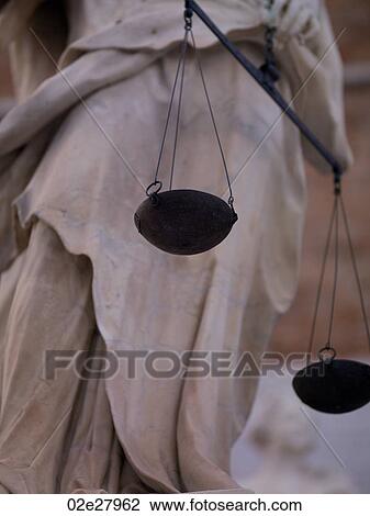 A statue holding scales in Venice View Large Photo Image Stock Image - A statue holding scales in Venice. Fotosearch