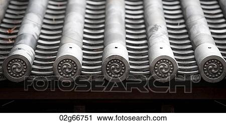 Stock Image - Architectural details of the traditional Japanese roof at the Imperial Palace, Tokyo, Japan. Fotosearch
