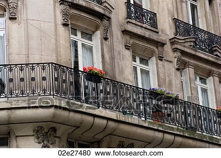 Stock Image - Balcony with flowers in Paris France. Fotosearch
