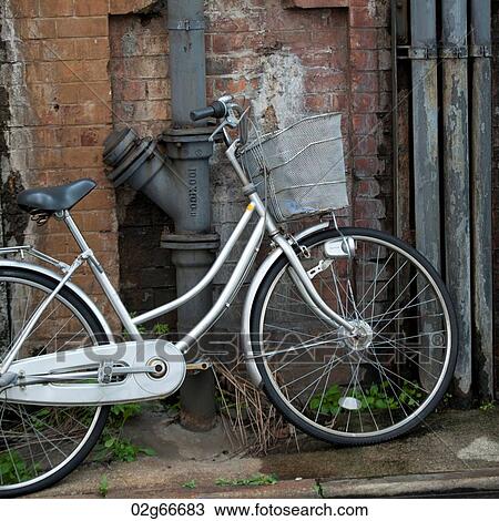 Bicycle parked against a wall, Ginza, Chuo Ward, Tokyo, Japan View Large Photo Image Stock Image - Bicycle parked against a wall, Ginza, Chuo Ward, Tokyo, Japan. Fotosearch