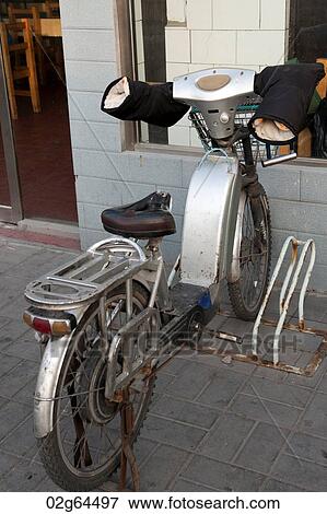 Bicycle parked in front of a house, Beijing, China View Large Photo Image Stock Photo - Bicycle parked in front of a house, Beijing, China. Fotosearch