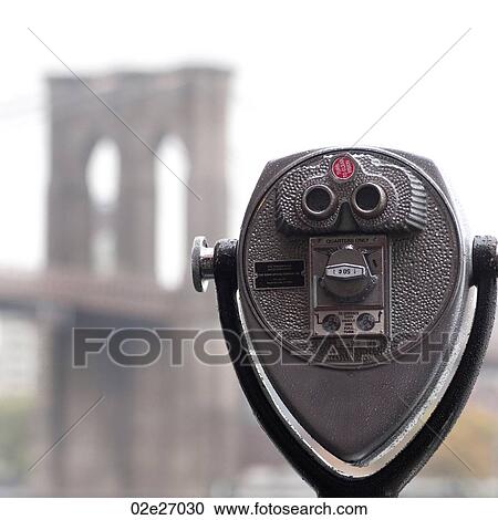 Stock Image - Binoculars on riverbank in Manhattan, New York City, U. S. A.. Fotosearch