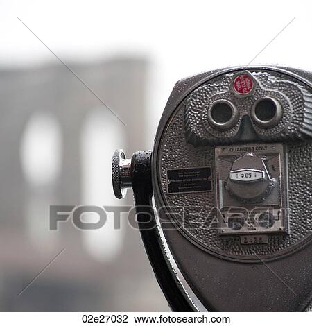 Stock Image - Binoculars on riverbank in Manhattan, New York City, U. S. A.. Fotosearch