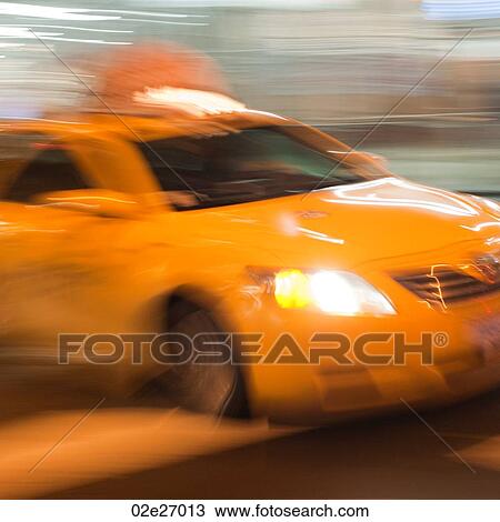 Blurred image of a yellow taxi in Manhattan, New York City, U. S. A. View Large Photo Image Stock Image - Blurred image of a yellow taxi in Manhattan, New York City, U. S. A.. Fotosearch
