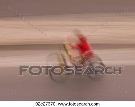 Blurred Person on bicycle in Paris France View Large Photo Image Stock Image - Blurred Person on bicycle in Paris France. Fotosearch
