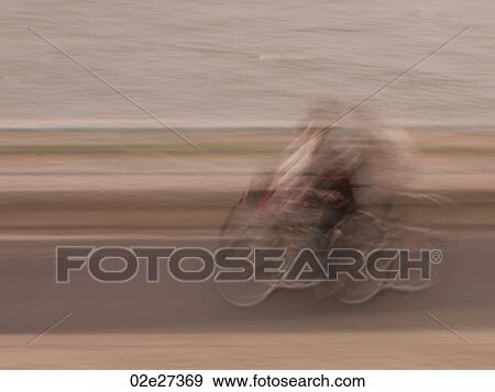 Blurred Person on bicycle in Paris France View Large Photo Image Stock Photo - Blurred Person on bicycle in Paris France. Fotosearch